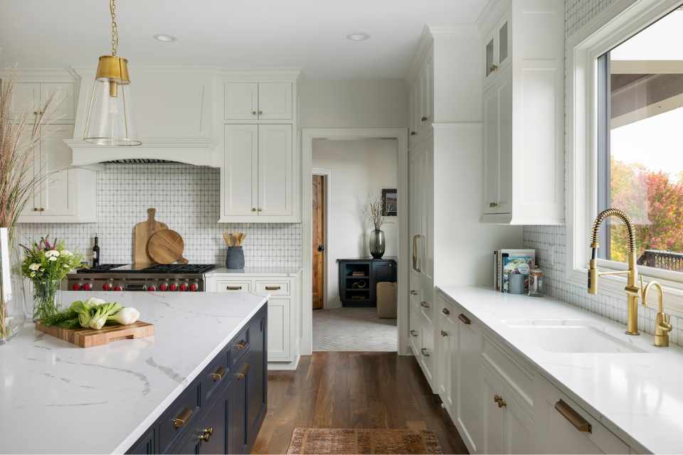 modern farmhouse kitchen with gold accents and white tile backsplash